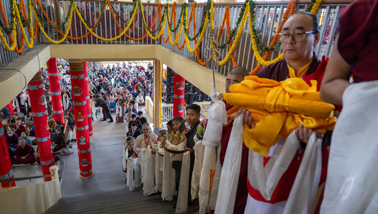 Members of the organizing groups lined up holding offerings for His Holiness the Dalai Lama during the Long Life Prayers at the Main Tibetan Temple in Dharamsala, HP, India on October 8, 2025. Photo by Ven Zamling Norbu