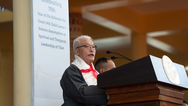 Tashi Namgyal, Chairman of the ex-Students Organizing Committee, speaking at the Celebration of the 75th Anniversary of His Holiness the Dalai Lama’s Assumption of the Spiritual and Temporal Leadership of Tibet at the Main Tibetan Temple courtyard in Dharamsala, HP, India on November 17, 2025. Photo by Tenzin Choejor