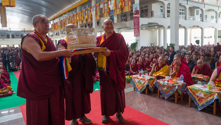 Representatives from the Gelugpa Buddhist Cultural Society holding a commemorative award in honour of the 51st anniversary of His Holiness the Dalai Lama being formally awarded the degree of Geshé Lharampa during Ganden Ngamchö Celebrations at Drepung Monastery in Mundgod, Karnataka, India on December 14, 2025. Photo by Tenzin Choejor