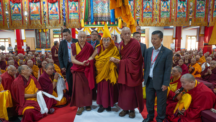 His Holiness the Dalai Lama arriving inside the Drepung Lachi Assembly Hall in to attend Long Life Prayers offered to him by Drepung Monastery and Rato Monastery in Mundgod, Karnataka, India on December 24, 2025. Photo by Ven Zamling Norbu