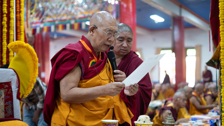 the current Drepung Tripa (Drepung Throneholder), Togden Rinpoché, reading out the decision to declare His Holiness the Dalai Lama the Drepung Tripa during the Enthronement Ceremony at Drepung Lachi Assembly Hall in Mundgod, Karnataka, India on December 24, 2025. Photo by Tenzin Choejor
