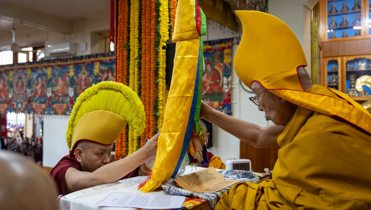 Kundelling Rinpoché presenting His Holiness the Dalai Lama with a long-life arrow during the Long Life Prayers at the Main Tibetan Temple in Dharamsala, HP, India on February 23, 2026. Photo by Ven Zamling Norbu