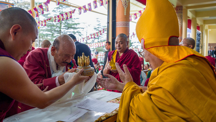 The National Convenor of the Core Group for the Tibetan Cause—India presenting traditional offerings to His Holiness the Dalai Lama during the Long Life Prayers at the Main Tibetan Temple courtyard in Dharamsala, HP, India on March 11, 2026. Photo by Tenzin Choejor