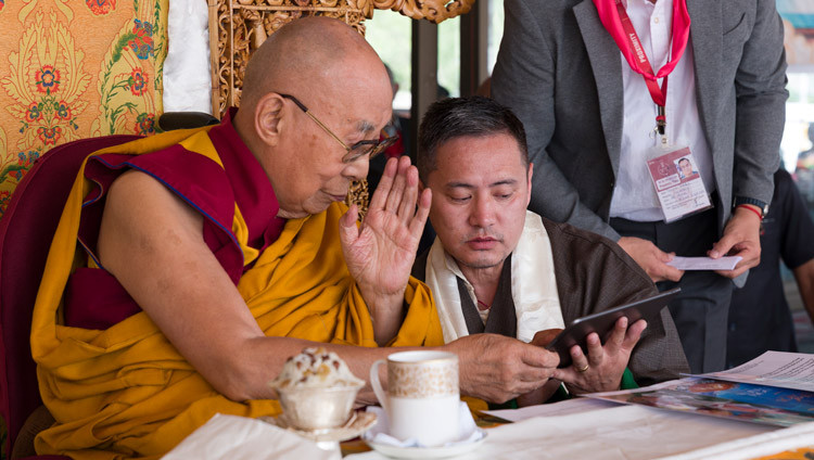 Tenzin Topdhen, Director of the Tibet Museum, holding an iPad which His Holiness the Dalai tapped to launch the animated film 'Man of Peace' during celebrations in honor of his 91st birthday in Leh, Ladakh, India on July 6, 2026. Photo by Tenzin Choejor
