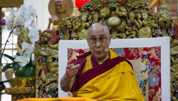 Tibetan Pilgrims Listen to His Holiness the Dalai Lama in the Tsuglagkhang