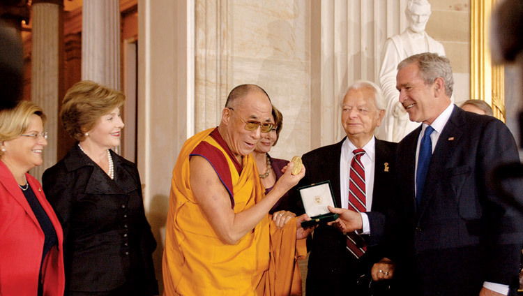 His Holiness the Dalai Lama receiving the US Congressional Gold Medal from US President George W. Bush at Capitol Hill in Washington DC, USA on October 17, 2007. His Holiness the Dalai Lama receiving the US Congressional Gold Medal from US President George W. Bush at Capitol Hill in Washington DC, USA on October 17, 2007.