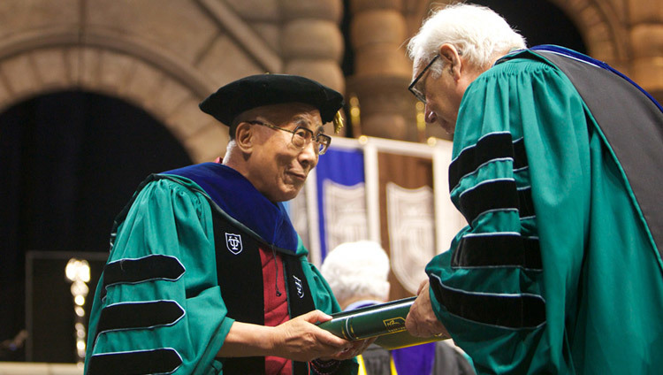 His Holiness the Dalai Lama accepting an honorary doctorate from Tulane University in New Orleans, Louisiana, USA on May 18, 2013. His Holiness the Dalai Lama accepting an honorary doctorate from Tulane University in New Orleans, Louisiana, USA on May 18, 2013.