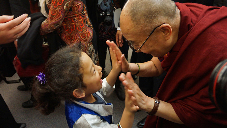 His Holiness the Dalai Lama greeting a young girl during his visit to Vancouver, BC, Canada on October 22, 2014. (Photo by Jeremy Russell/OHHDL) His Holiness the Dalai Lama greeting a young girl during his visit to Vancouver, BC, Canada on October 22, 2014. (Photo by Jeremy Russell/OHHDL)