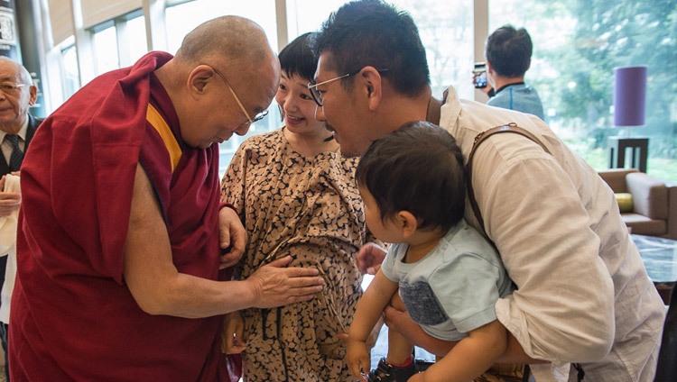 His Holiness the Dalai Lama blessing an expectant mother as he leaves his hotel in Narita on his way to Osaka, Japan on May 9, 2016. (Photo by Tenzin Choejor/OHHDL) His Holiness the Dalai Lama blessing an expectant mother as he leaves his hotel in Narita on his way to Osaka, Japan on May 9, 2016. (Photo by Tenzin Choejor/OHHDL)