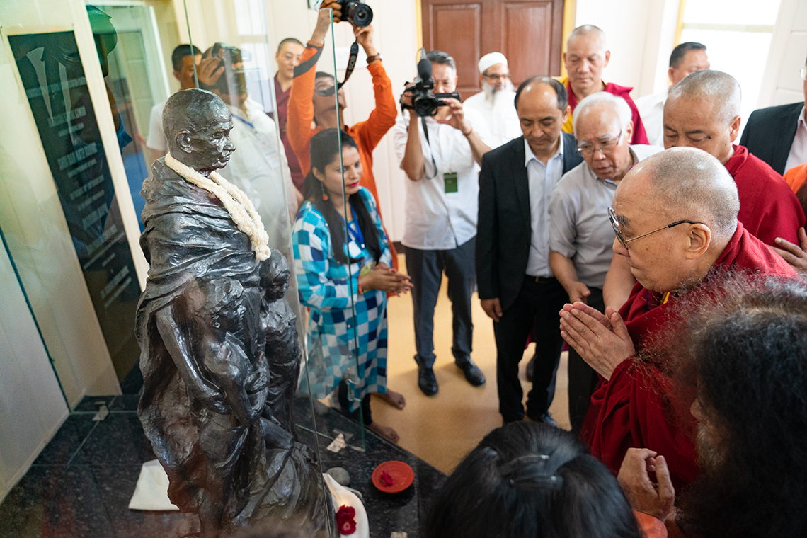 His Holiness the Dalai Lama paying his respects to a statue of Mahatma Gandhi during his visit to the Mahatma Gandhi Library at Gandhi Ashram, Kingsway Camp, New Delhi, India on September 25, 2019. Photo by Tenzin Choejor His Holiness the Dalai Lama paying his respects to a statue of Mahatma Gandhi during his visit to the Mahatma Gandhi Library at Gandhi Ashram, Kingsway Camp, New Delhi, India on September 25, 2019. Photo by Tenzin Choejor