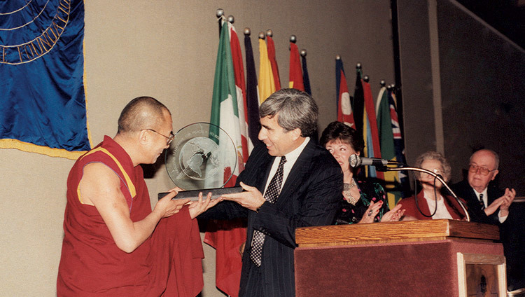His Holiness the Dalai Lama accepting the Distinguished Peace Leadership Award from David Krieger, Executive Director of the Nuclear Age Peace Foundation, in Santa Barbara, California, USA on April 6, 1991. His Holiness the Dalai Lama accepting the Distinguished Peace Leadership Award from David Krieger, Executive Director of the Nuclear Age Peace Foundation, in Santa Barbara, California, USA on April 6, 1991.