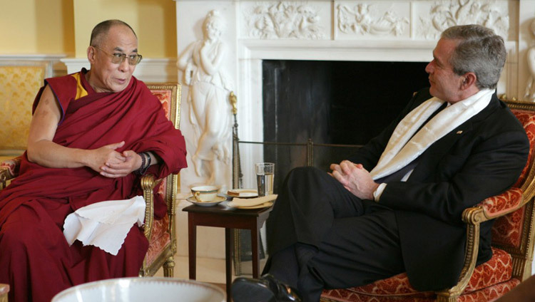 US President George W Bush wearing a scarf that was presented to him by His Holiness the Dalai Lama at the White House in Washington DC, USA on November 9, 2005. (Official White House Photo) US President George W Bush wearing a scarf that was presented to him by His Holiness the Dalai Lama at the White House in Washington DC, USA on November 9, 2005. (Official White House Photo)